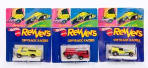 MATTEL: Hot Wheels Group of 3 1970s 'Revvers' Including Haulin Horses (6988) Yellow; And, Burnin Box (6996) Red; And, Passin Pride (6998) Yellow. All mint in original cardboard packaging.
