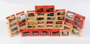 LLEDO: Group of 'Models of Days Gone' including Royal Mail Collectors Series Commemorative '350 year' Van; And, Cookie Coach Company Van. Most mint, all in original cardboard boxes. (38 itmes)&nbsp;