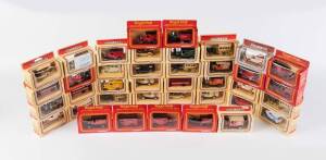 LLEDO: Group of 'Models of Days Gone' including Royal Mail Collectors Series Commemorative '350 year' Van; And, Cookie Coach Company Van. Most mint, all in original cardboard boxes. (38 itmes) 