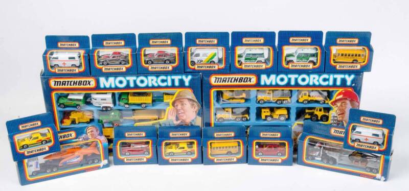 MATCHBOX: Group of Model Cars and Trucks Including a Pair of 'Motorcity' sets (MC-7 & MC-8); And, DAF Aircraft Transporter Convoy (CY-21); And, Kenworth Helicopter Transporter (CY-11). All Mint in original cardboard boxes with lables. (17 items)