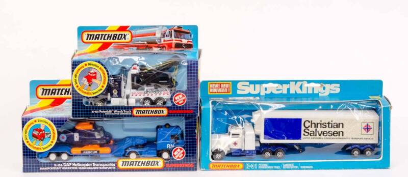 MATCHBOX: A Group of 'SuperKings' Model Trucks Including Peterbilt Wreck Truck (K-121); And, DAF Helicopter Transporter (K-126); And, Christian Salvesen Peterbilt Refrigeration Truck (K-31). All in original cardboard boxes. (3 items)