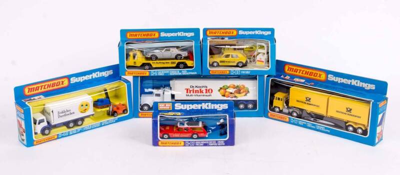 MATCHBOX: Group of 'Super Kings' Model Cars and Trucks Including Container Truck (K-17); And, Delivery Truck and Fork Lift (K-40); And, Dodge Monaco Fire Chief (K-67). Most Mint, all in original cardboard packaging. (12 items)