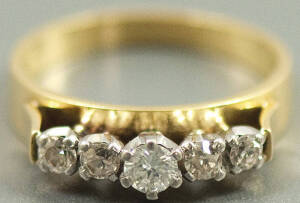 GOLD RING: 18ct Gold ring set with a single row of (5) diamonds ranging in size fron 15 to 25 points each. Excellent condition.