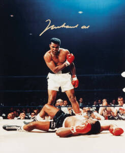 MUHAMMAD ALI, signed colour photograph of Ali standing over Sonny Liston, size 28x35cm. With CoA.