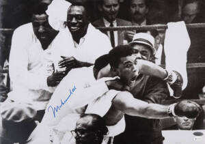 MUHAMMAD ALI, signed photograph from the Muhammad Ali vs Sonny Liston fight, February 25th 1964, size 51x36cm. With 'Online Authentics' No.OA-0000177.