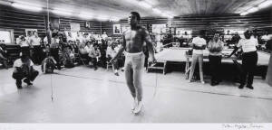 MUHAMMAD ALI, photograph titled "Muhammad Ali, Deer Lake, PA, August 1974. MA18 Jumping Rope" by Peter Angelo Simon, silver gelatin print, signed by the photographer lower right, size 50x40cm.