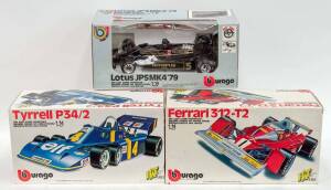 BURAGO: 1:14 Group of Model Formula 1 Cars Including Tyrrell P34/2 (2102); And Ferrari 312-T2 (2101); And, Lotus JPSMK4 (2105). All cars mint with some slight damage to some of the boxes. (3 items) 