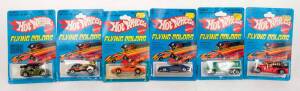 MATTEL: Group of Vintage 1970s Hotwheels 'Flying Colors' Blister Packs Including '56 Hi-Tail Hauler (9647); And, Hot Bird (2014); And, T-Totaller (9648). Most mint, all on original cardboard cards. (76 items)