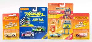 MATCHBOX: Group of Model Car Blister Packs Including 'The Automotive Superstars' 1962 Corvette (83006); And, 'Racing Action Pack' Dodge Challenger (50110); And, 'Days of Thunder' (32520). All mint and unopened on original cardboard cards. (24 items)