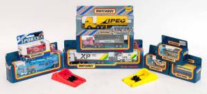 MATCHBOX: Group of Model Cars and Trucks Including Express Parcel Systems Team Convoy (TC4); And, Peterbilt Tipper (CY106); And, BMW 323i Cabriolet and Caravan. All mint in original cardboard packaging. (22 items)