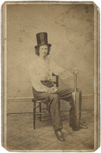 Cricket Carte de visite: Photo portrait of a seated cricketer (c1865) by Ed B.Rodgers of Hamilton Ohio. Sitters name and some details also on the reverse in ink (William Lauder?). A rare piece. Corners trimmed, good condition.