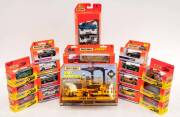 MATCHBOX: Group of Model Cars Including 'Dirt Machines' Road Pavers (32957); And, 'Convoy' Truck and Trailer (32951); And, 5 Set Coffret (32921). Most mint all in original cardboard packaging. (94 items)