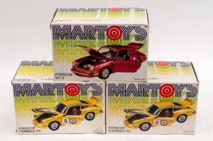 MARTOYS: 1:24 Porsche Model Cars Including A Pair of Porsche Carrera RS (114); And Porsche 911 S (102). All cars mint, all in original cardboard packaging with slight damage to some of the boxes. (3 items)