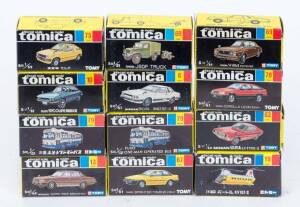 TOMICA: Group of Model Cars Including DD13 Type Diesel Locomotive (17); And, Fuso One-Man Operated Bus (79); And, Corolla Levin 3 Door (78). Most mint in original cardboard packaging.