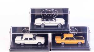 TRAX: 1:43 1965 Chryseler AP6 Valiant V8 Sedan (TR81C) Alpine White/Black Vinyl Roof; and 1970 Chrysler VG Valiant Pacer Sedan (TR64D) Hot Mustard; and 1969 Valiant VF Valiant Pacer (TR63D) Alpine White. All mint in original plastic cases with original ca