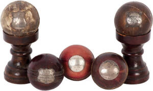 CRICKET TROPHY BALLS: Attractive collection of late 19th and early 20th century English trophies (2 on wooden stands), note; "Heathfield C.C. to J.A.West 1887"; "1894 Best Average F.C.Werner 105 wickets, 324 runs". Condition ranges from Fair to VG.