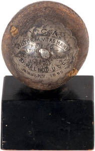 VICTORIA v TASMANIA: Cricket trophy Ball "V.C.A. Victoria v Tasmania. Played at Hobart. Best bowling average won by D.McLeod. U.C.C. January 1895". Daniel Hutton McLeod played for Victoria 1892-1895. Trophy sits on an ebonized wooden base. Fair condition.