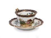 A Russian porcelain hand painted and gilded cup and saucer, Gardner Porcelain Factory, Verbilki, Russia, circa 1840; saucer 18cm diameter. A gift to Heifetz from a member of the Czar's family in gratitude for a performance by the young artist before his d