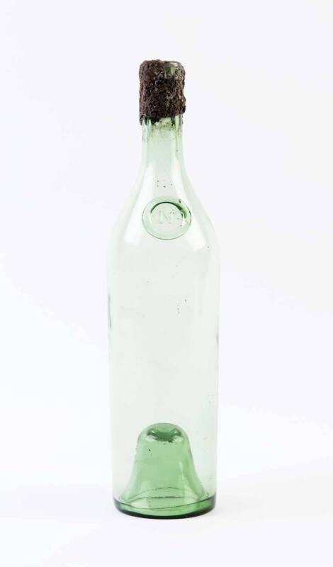 A vintage green glass Napoleon brandy bottle (empty), 19th century; originally presented to Jascha Heifetz on his induction into Napoleon's Legion; 31cm high.