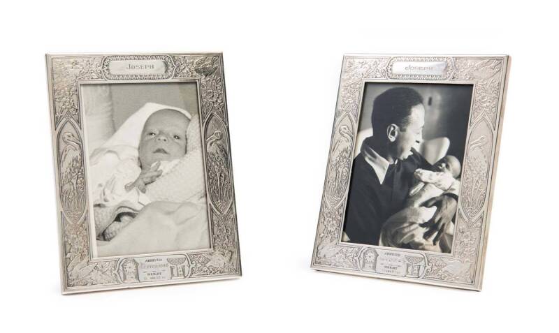 Matching pair of sterling silver photo frames; one containing a photograph of baby Joseph (Jay) in the arms of his father, Jascha; the other with a photograph of the baby. Both frames engraved "JOSEPH. Arrived Sept.29, 1948. Weight 6 lbs 10oz". (2 items).