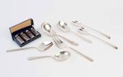 A collection of silver plated items comprising a boxed set of two pairs of blue glass salt and pepper shakers with pierced silver plated mounts, two pairs of salad servers and three serving spoons