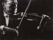 Gjon Mili [1904-1984] original silver gelatin print photograph of Heifetz performing; with studio stamp on reverse.&nbsp;