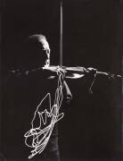 Gjon Mili [1904-1984] original silver gelatin print time-lapse photograph of Heifetz performing in a darkened room with a light attached to the end of his bow; 1952, with studio stamp and manuscript endorsements on reverse.&nbsp;