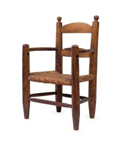 A provincial rush seated wooden child's chair, 20th century; custom made for Jascha Heifetz for his son Jay in the early 1950s, 52cm high. Heifetz' design for this chair was intended to resemble the chair he had used as a child at his home in Vilnius.