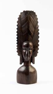 A Carved Wooden African Bust; carved hardwood; with original sticker on base from Dar es Salaam; 40 cm high.Presented to Heifetz in 1959 by the United Nations, following his internationally-broadcast concert for the General Assembly.