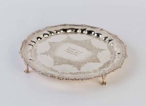 A silver plated circular floral engraved salver, inscribed "In reflection of the ones I love, 2 March 1971"; 32cm diameter. Crenellated rim and raised on pad feet.