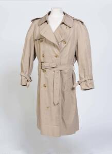 Jascha Heifetz' Burberry rain coat; double breated, with epaulettes, self belt and plaid lining. The "JH" monogram incorporated into the label. Fine condition.