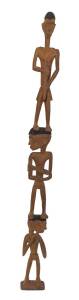 A Carved Ancestral Pole, Asmat Region,(Irian Jaya) late 20th Century)Carved wood and pigment113 cm highAsmat tribal village, early 1990s.