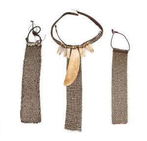 Three Cowrie Shell Necklaces; cowrie shells, shells, rattan, strong, beads, and animal skin; 52 cm; 45 cm; 39.5 cm long.Asmat & Dani tribal villages, early 1990s.