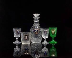 A Russian Imperial Glass Factory cut glass part liqueur set, late 19th century from the Alexandria Banqueting Service, comprising a decanter with stopper, a tumbler, two stemmed glasses and a green stemmed cut glass, the decanter 22cm high. (6 pieces) Eac