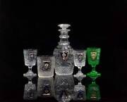 A Russian Imperial Glass Factory cut glass part liqueur set, late 19th century from the Alexandria Banqueting Service, comprising a decanter with stopper, a tumbler, two stemmed glasses and a green stemmed cut glass, the decanter 22cm high. (6 pieces) Eac