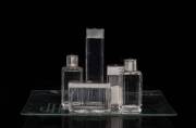 A five piece Continental silver mounted dressing table set monogrammed "J.H." on a square glass tray, 20th century; the tray 30.5 x 30.5cm. (6 items). Heifetz had this set made for him early in his concert career, and, in an accompanying case, they became