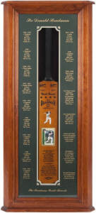 DON BRADMAN, display "Sir Donald Bradman - The Bradman World Records" comprising signed card affixed to replica "Sykes" Cricket Bat, in attractive display case, overall 50x114cm. With CoA.