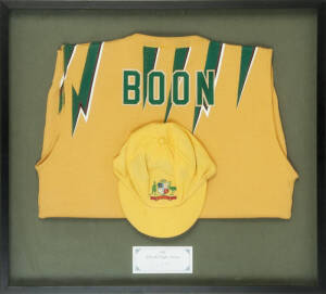 DAVID BOON'S AUSTRALIAN "BAGGY YELLOW" ONE DAY INTERNATIONAL CAP & ODI JUMPER: Cap yellow wool, with embroidered Australian Coat-of-Arms on front; ODI jumper with "BOON" on reverse, framed & glazed, overall 73x56cm. Fine condition. [David Boon played 107 