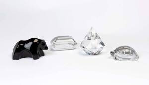 Four crystal paper weights, 20th Century; two stamped Baccarat and another Tiffany & Co.; the tallest 10cm.