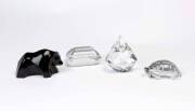 Four crystal paper weights, 20th Century;&nbsp;two stamped Baccarat and another Tiffany & Co.; the tallest 10cm.