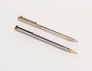 Tiffany & Co. sterling silver retractable pencil; accompanied by a Tiffany silver plate biro and letter opener. circa 1960. (3 items).