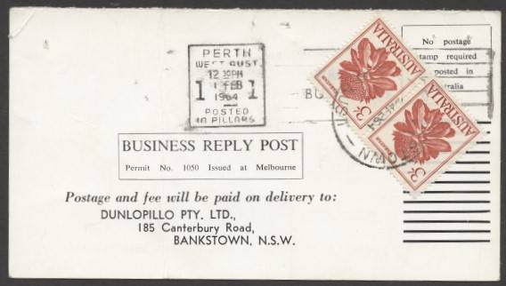 Commonwealth Postal History - 1964 Dunlopillo business reply postcard returned unfranked as intended with €˜PERTH/WEST AUST/1FEB/1964/POSTED/IN PILLARS€™ machine cancel and Flowers 3/- Waratah x2 affixed tied €˜BANKSTOWN/-4FEP64/N.S.W-AUST€™ cds to pay 5d