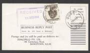 Commonwealth Postal History - 1964 Dunlopillo business reply postcard returned unfranked as intended with €˜OUSE/14AP64/TAS.€™ cds and 2/6d Aborigine affixed tied €˜BANKSTOWN/18AP64/N.S.W-AUST€™ d/s to pay 5d domestic postcard rate plus 1d business reply