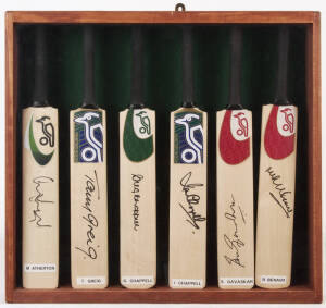 SIGNED MINIATURE BATS, in display case 48x45cm, noted Mike Atherton, Tony Greig, Greg Chappell, Ian Chappell, Sunil Gavaskar & Richie Benaud.