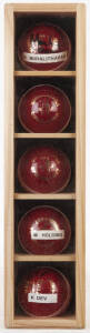 SIGNED CRICKET BALLS, in display case 10x42cm, noted Muttiah Muralitharan, Shane Warne, Courtney Walsh, Michael Holding & Kapil Dev.