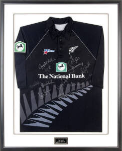 2004 NEW ZEALAND TEAM, Jacob Oram's NZ One Day shirt with 12 signatures including Stephen Fleming, Chris Cairns, Craig McMillan & Daniel Vettori, window mounted with plaque "New Zealand, ODI Team, Wellington 20/2/2004", framed & glazed, overall 87x108cm. 