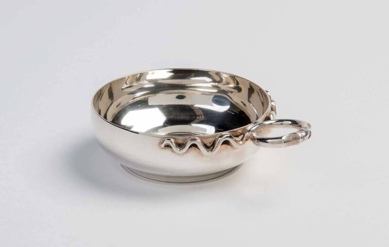 A French silver tastevin with plain bowl and twisted snake handle, maker's mark "SF"