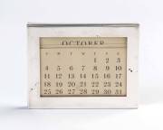 A Tiffany & Co sterling silver rectangular desk perpetual calendar; 7.5cm high.