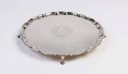 A Tiffany & Co sterling silver salver, 1907/47, with engraved initials "JH" within rococo cartouche, scroll border, John C. Moore President mark, no. 20078/283, "Original by Robert Abercromby, London 1735" mark; 31cm diameter, 810 grams. Purchased by Heif