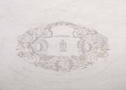 A Tiffany & Co sterling silver salver, 1907/47, with engraved initials "JH" within rococo cartouche, scroll border, John C. Moore President mark, no. 20078/283, "Original by Robert Abercromby, London 1735" mark; 31cm diameter, 810 grams. Purchased by Heif - 2